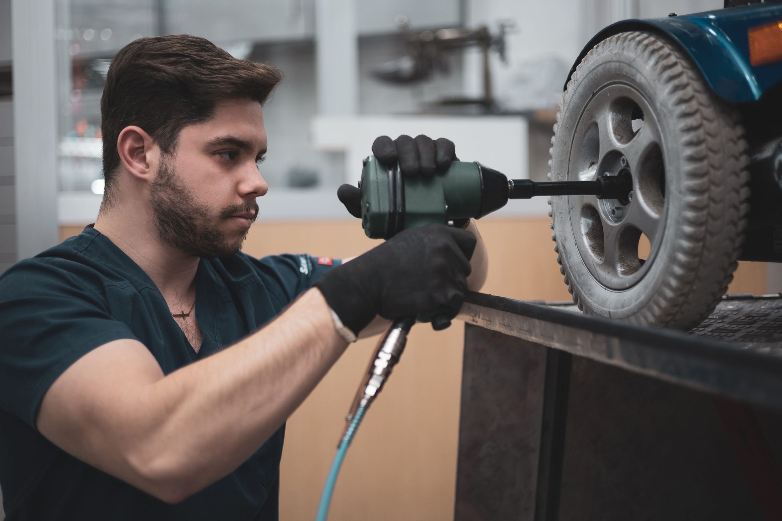 Service tech fixing Scooter